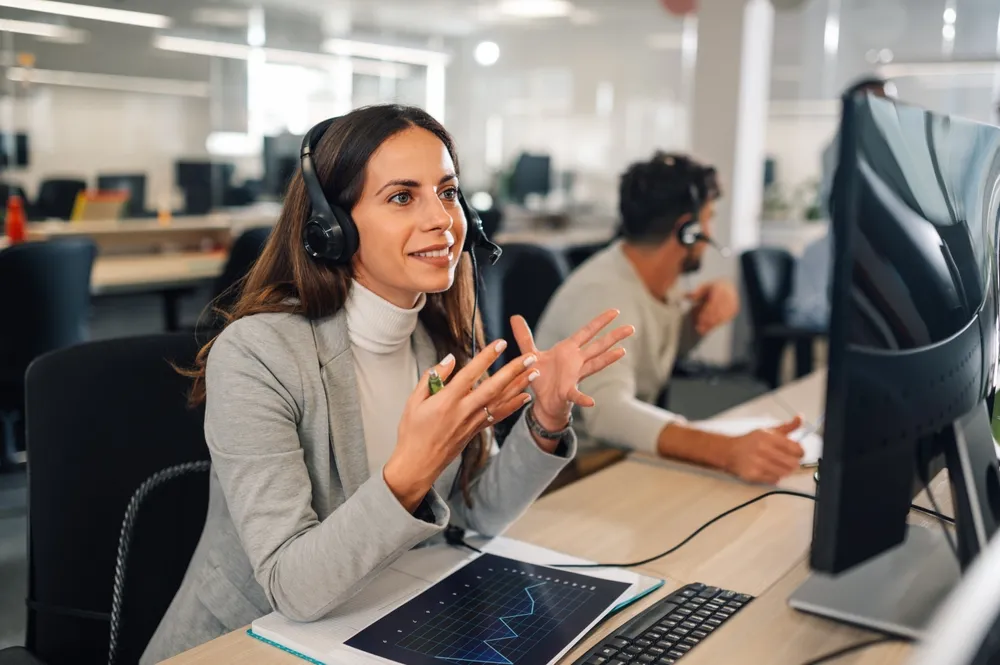 Service desk agent with a headset helping a customer