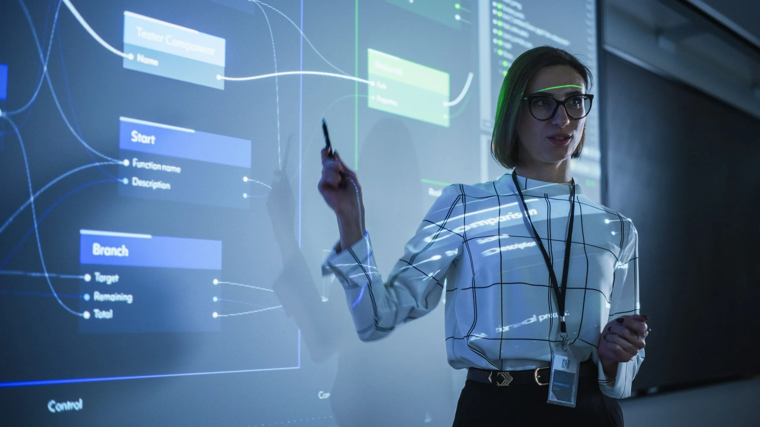 Presenter explaining a learning workflow on a digital screen