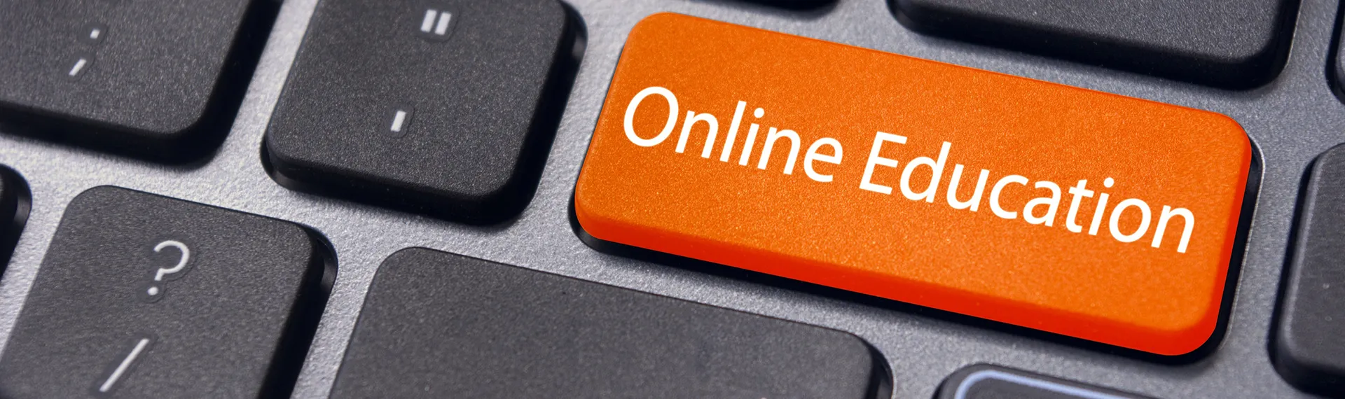 Keyboard with an orange Online Education key