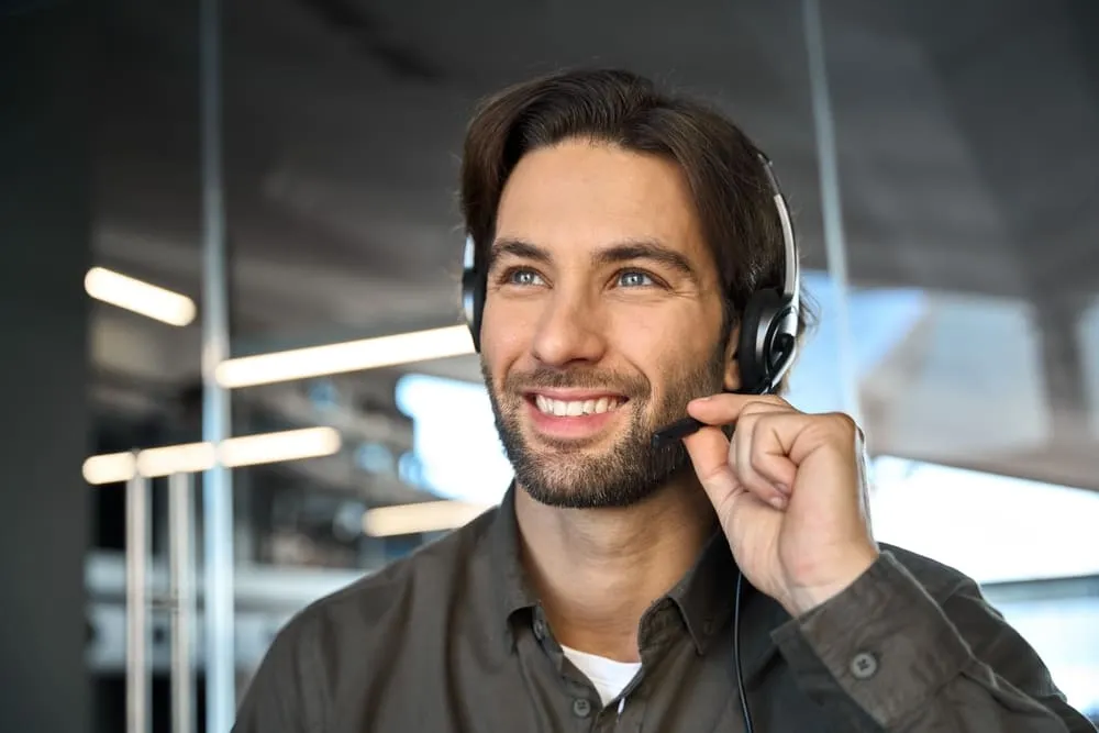 Smiling support agent wearing a headset